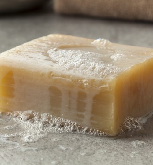 Wet piece of traditional Moroccan soap with foam for hamam