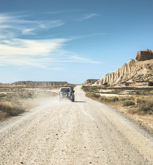 Tourist car and vintage dirt road