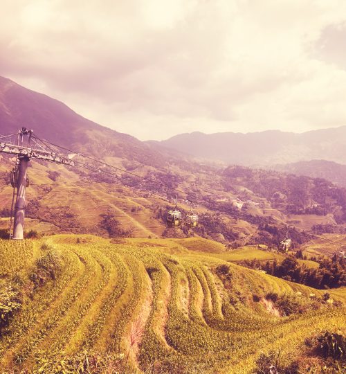 Cable car above the Longji Rice terraces (Dragons Backbone) in Longsheng County, color toned picture, China.