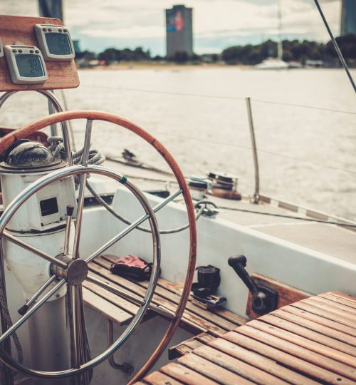 Steering wheel on a yacht.