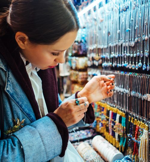Young girl tourist walking in the old souvenir market in Istanbul, Turkey