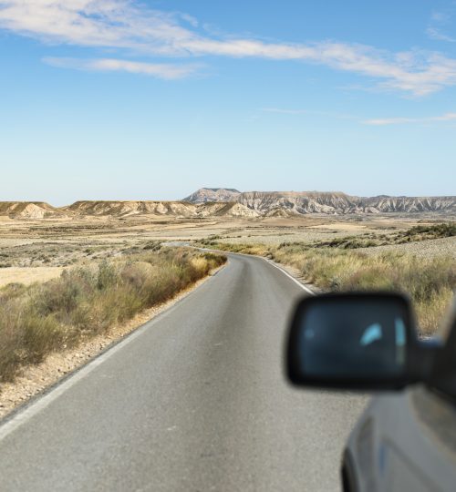 Tourist car and vintage dirt road